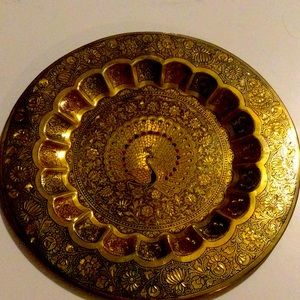 Wall decor item made of brass coat with designs of peacock